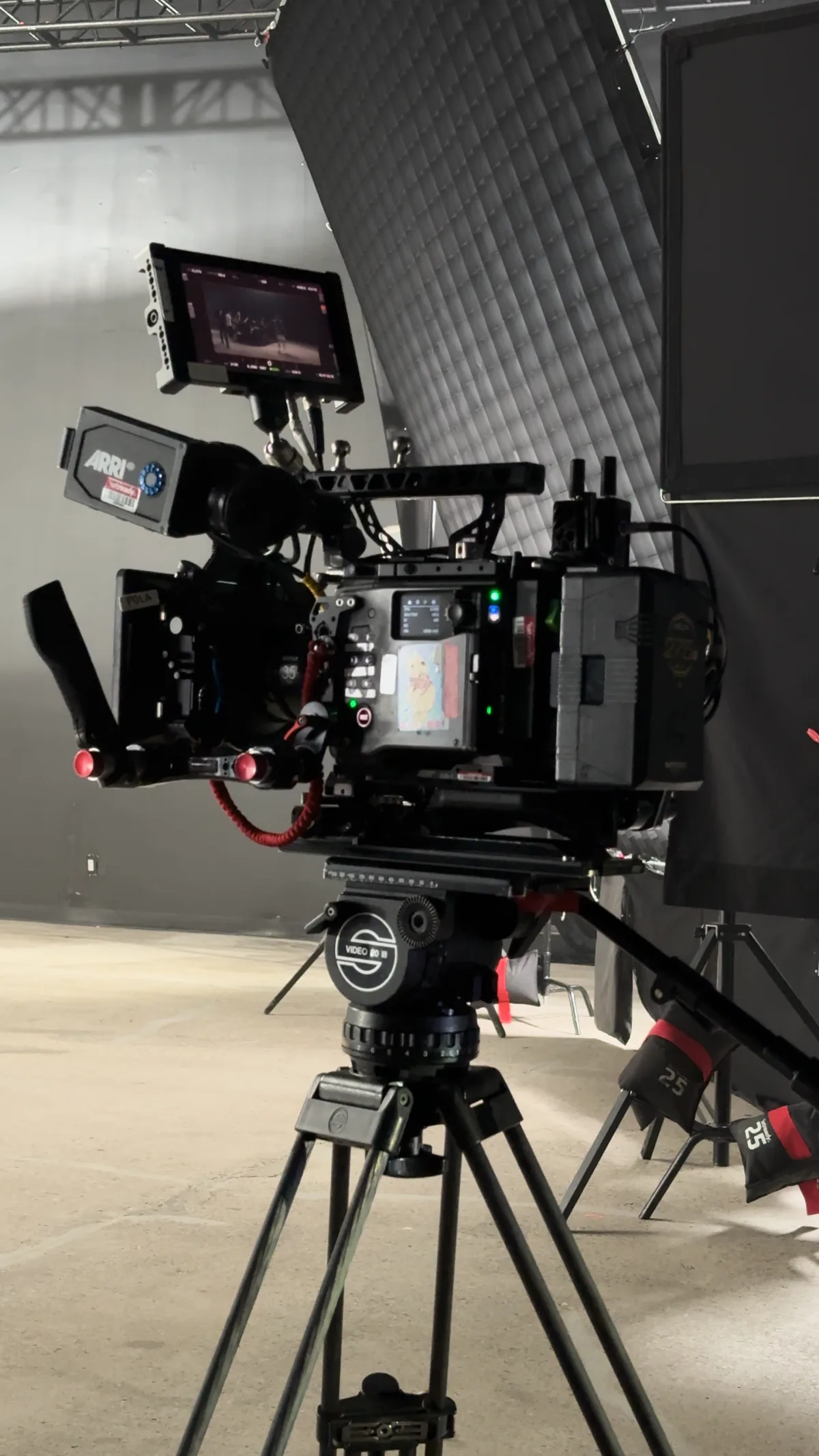 An ARRI cinema camera rigged and ready on set at Demo Room